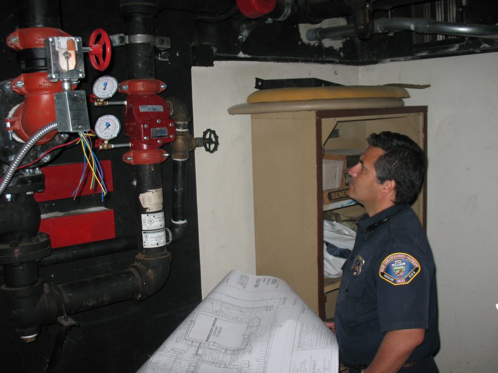 Fireman inspecting sprinkler system