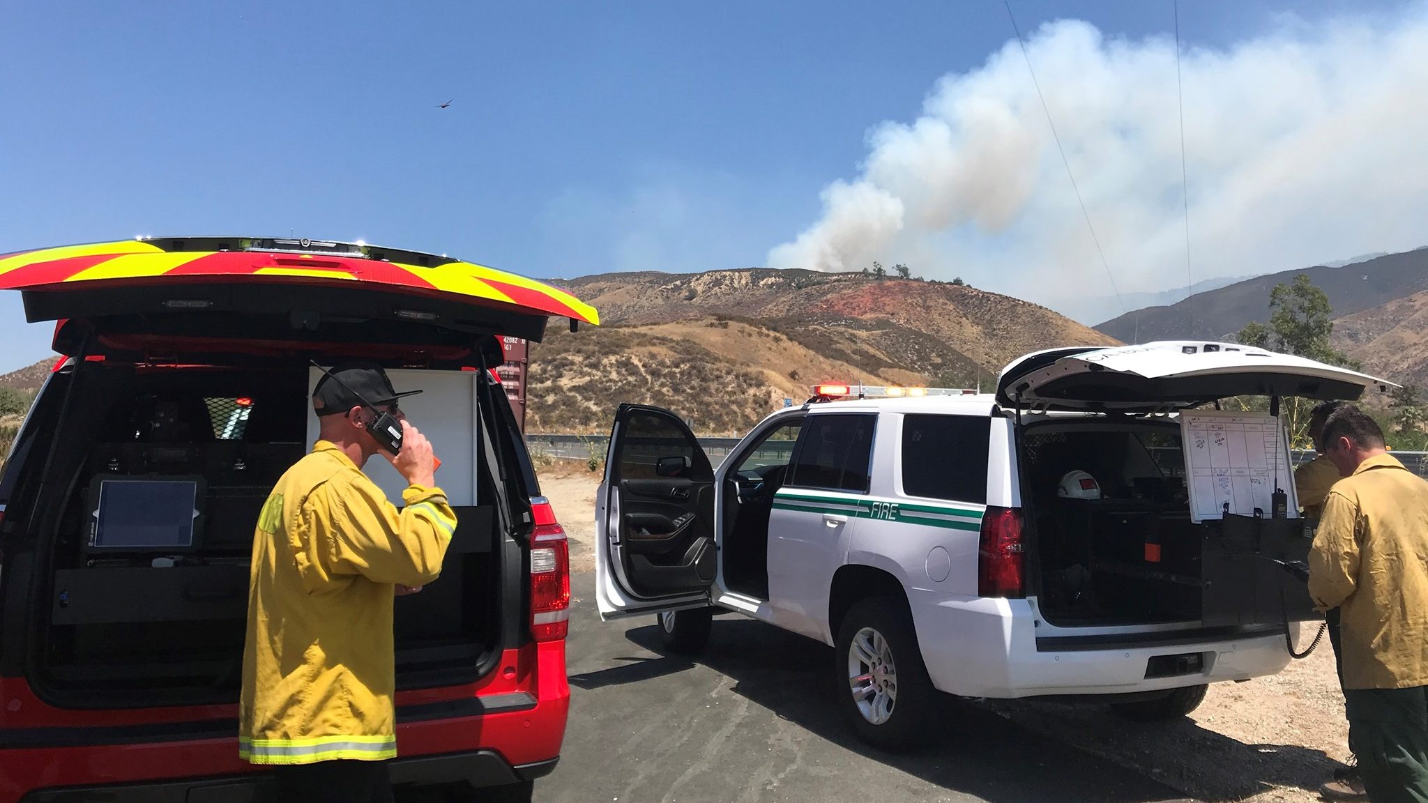 Peak Fire's rapid spread near San Bernardino prompts Highway 18 closure; firefighter injured.