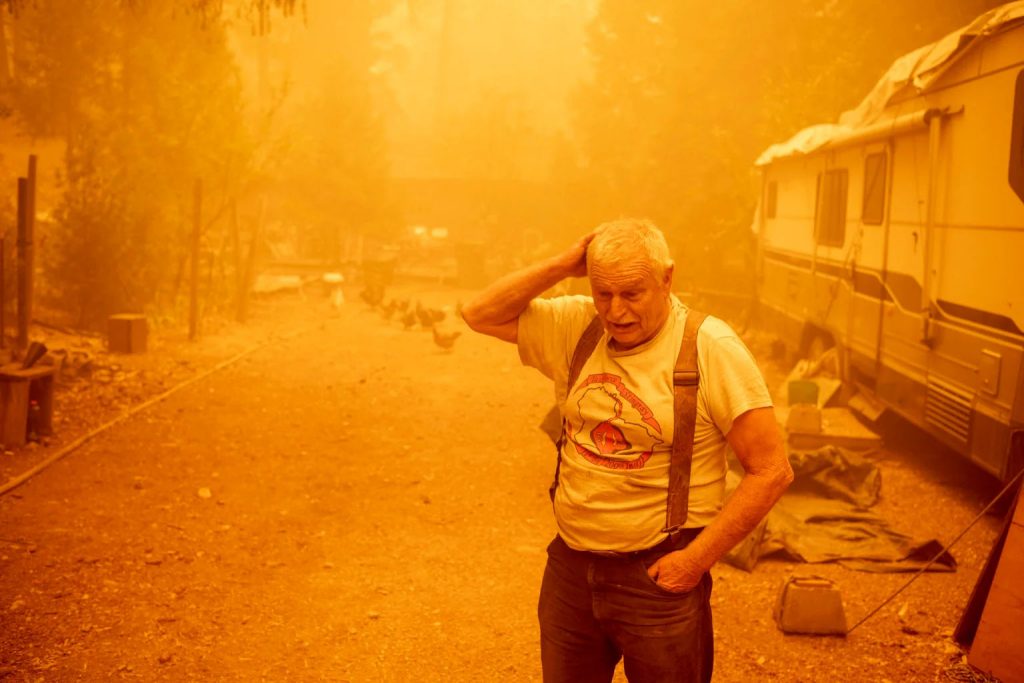 Resident Jon Cappleman prepares to defend his home during the Dixie fire in Twain, California on July 24, 2021. AFP