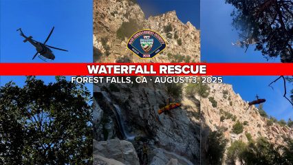 A composite image showing a helicopter rescue operation in a mountainous area. The central red banner reads “WATERFALL RESCUE – FOREST FALLS, CA – AUGUST 3, 2025” with the San Bernardino County Fire Department logo above it. The left image shows a helicopter flying above treetops against a clear blue sky. The center image features rescuers and a waterfall on a steep rocky cliff. The right image shows a person being airlifted in a rescue basket by a helicopter hovering above the trees and canyon.