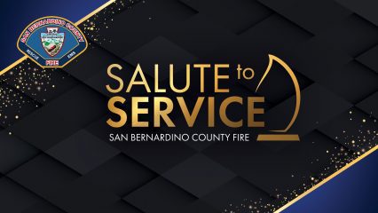 San Bernardino County Fire Salute to Service graphic with department badge and gold award icon on black background.