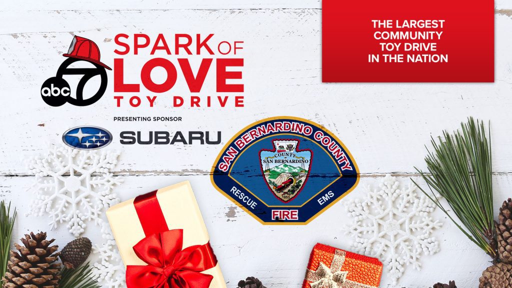 ABC7 Spark of Love Toy Drive graphic with Subaru logo, San Bernardino County Fire badge, and holiday decorations.